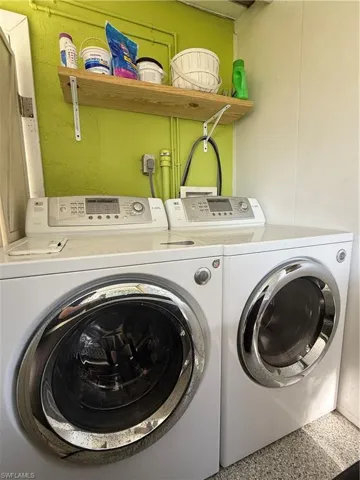 Washroom featuring washing machine and dryer