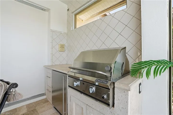 Outdoor grill and refrigerator