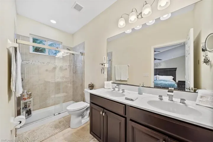Primary Bedroom with Luxury Vinyl Plank Flooring and Huge Walk-in Closet.