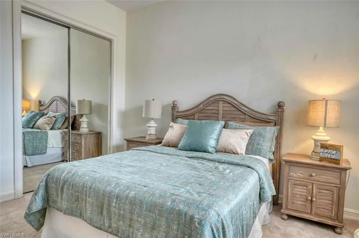 Bedroom featuring a closet and light colored carpet