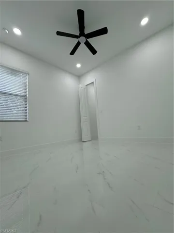 Unfurnished room featuring ceiling fan