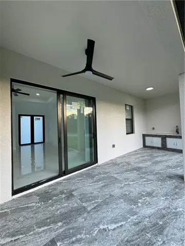 View of patio / terrace featuring ceiling fan and kitchenette.