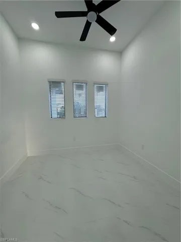 Spare room featuring ceiling fan