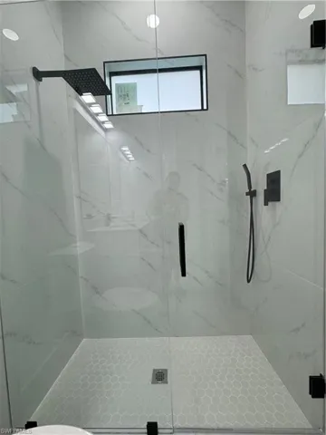 Bathroom with an enclosed shower
