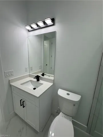 Bathroom with vanity and toilet