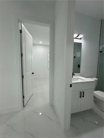 Entrance to Bathroom and bed.