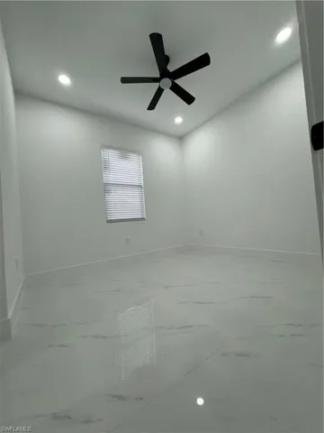 Spare room with ceiling fan