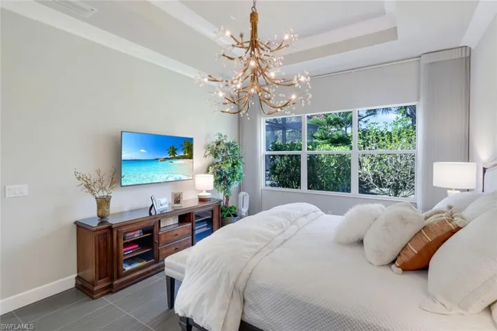 Three large windows with custom window treatments allow natural light to flow through!