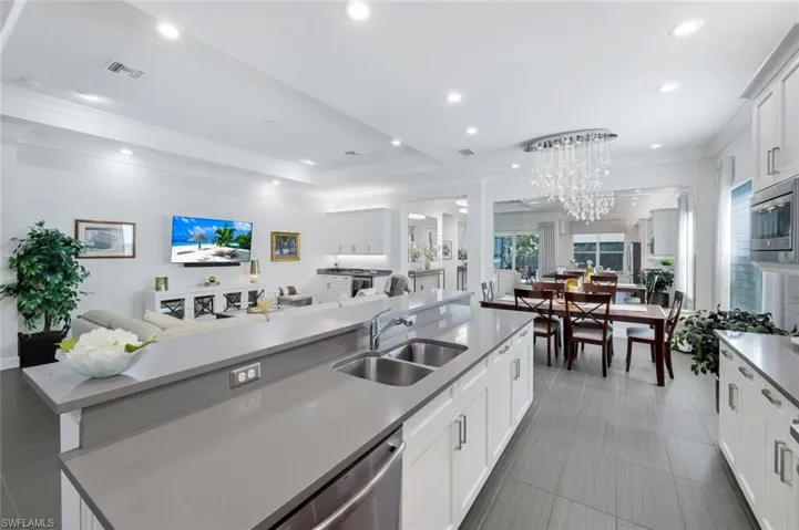 The chef is included in the entertaining space and has views of the living and outdoor pool area- a lovely open space where all square footage is enjoyed!