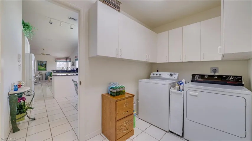 Laundry room with built in cabinets