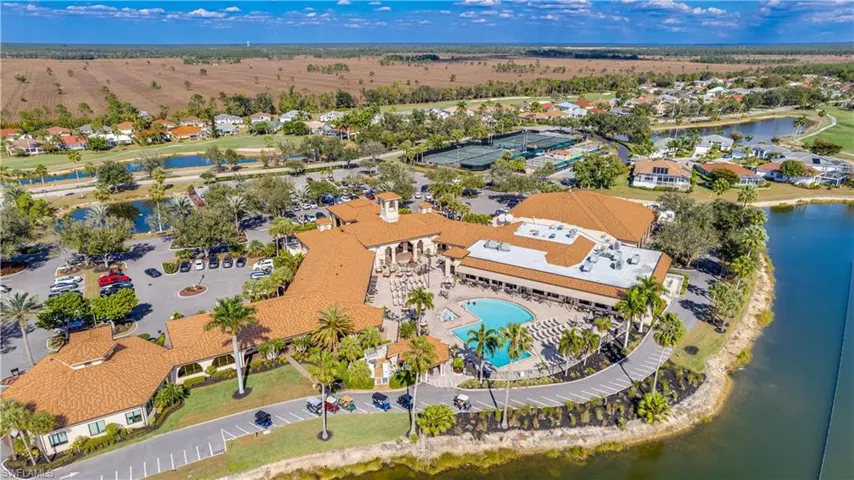 Aerial view of property's location with a large body of water