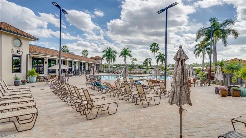 Community pool with a patio area