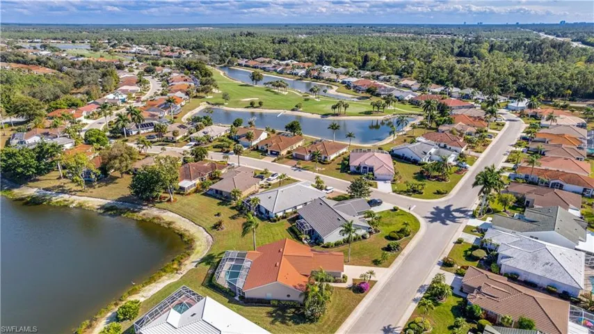 Ariel view of property location with a large body of water and the golf course
