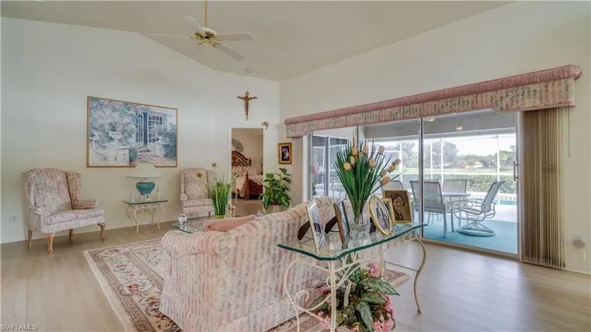 Living area featuring LVP flooring and cathedral ceilings
