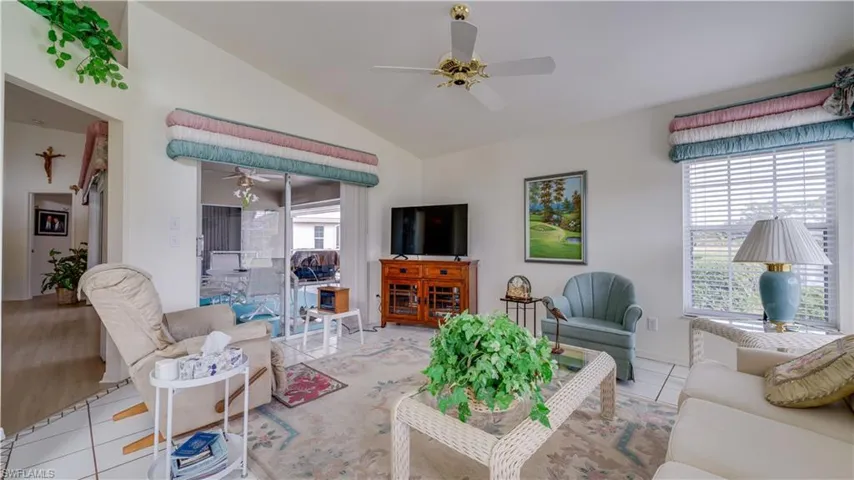 Tiled family room with sliders to the lanai