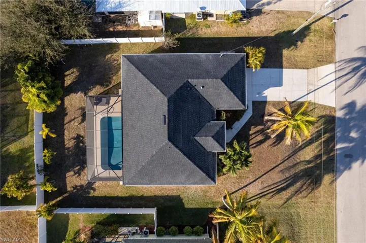 View of subject property featuring a pool