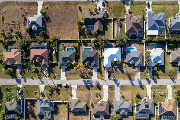 Aerial perspective of suburban area with property boundaries highlighted