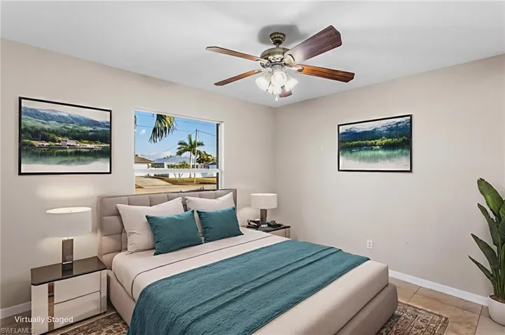 VirtuallyStaged Bedroom featuring baseboards and a ceiling fan