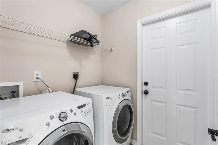 Laundry area featuring High Efficiency washer and dryer