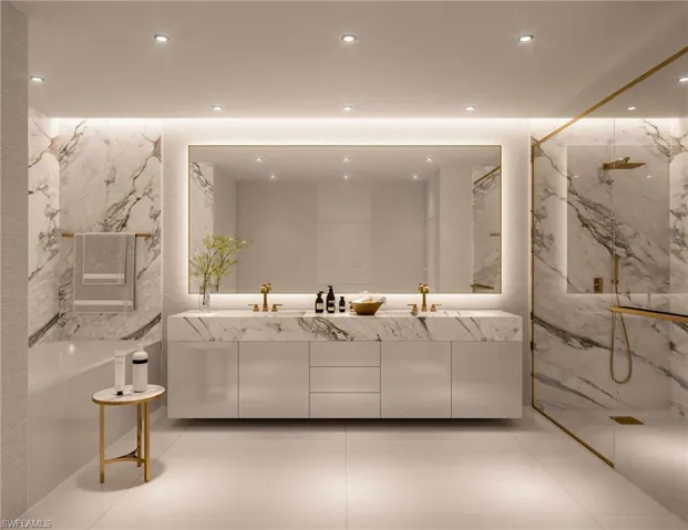 Bathroom featuring tile floors, dual sinks, tiled shower, and oversized vanity
