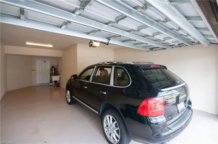 Garage featuring a garage door opener