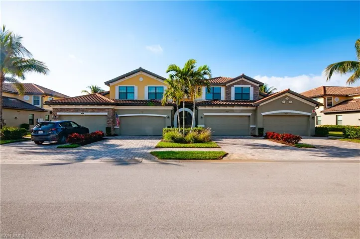 Mediterranean / spanish-style home with a garage