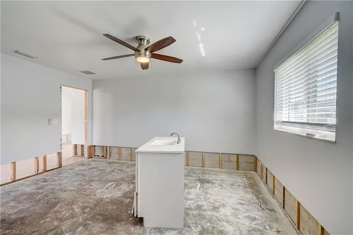 Primary bedroom with ceiling fan