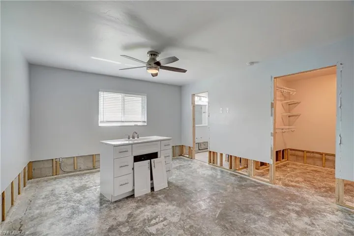 Primary bedroom featuring ceiling fan