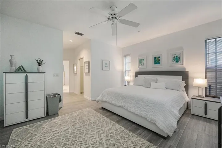 Bedroom featuring wood finished floors and a ceiling fan