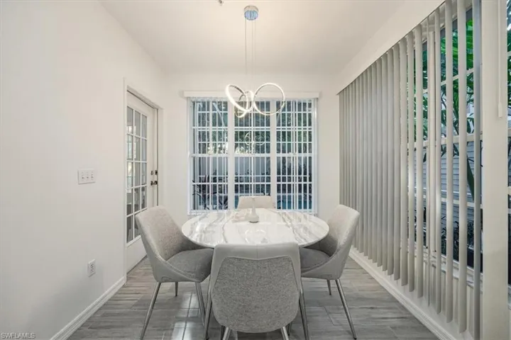 Dining area featuring a chandelier and wood finished floors
