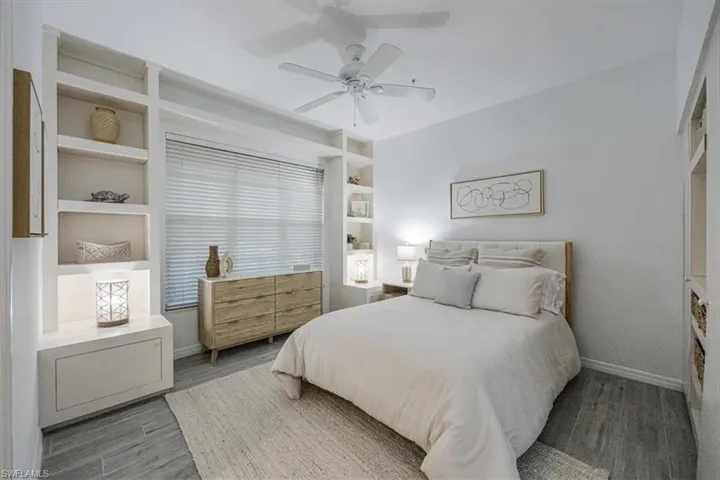 Bedroom with wood finished floors and ceiling fan