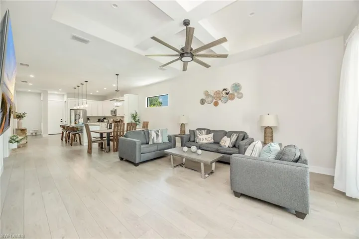 Open-concept living space featuring wood-finish flooring throughout