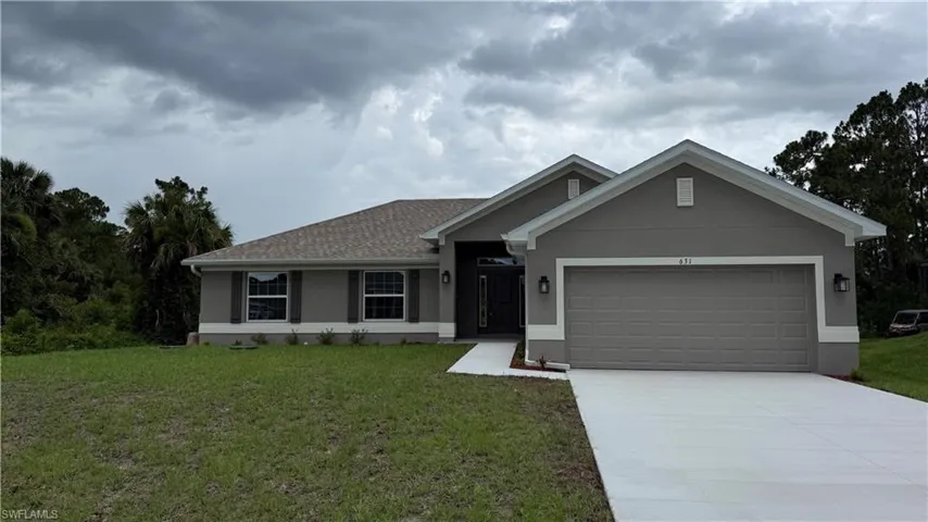 Contemporary single-story residence featuring a two-car garage, gray stucco exterior, white trim, and a shingle roof