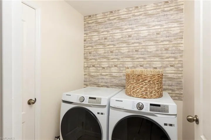 Laundry room featuring new washing machine and clothes dryer