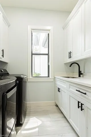 Laundry w Sink and Plenty of Cabinets