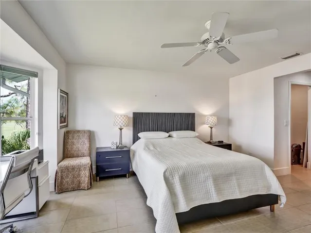 Bedroom featuring ceiling fan and light tile patterned flooring