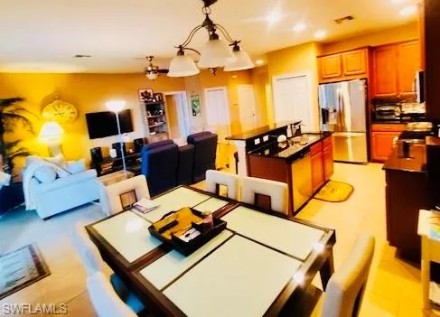 Dining area featuring a chandelier and recessed lighting