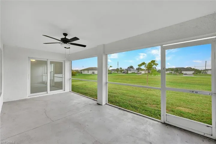large screened lanai with garden views