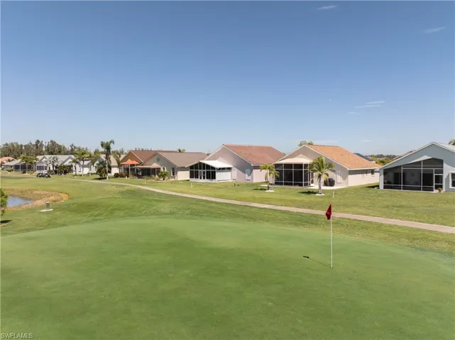 View of home's community with a residential view and a lawn