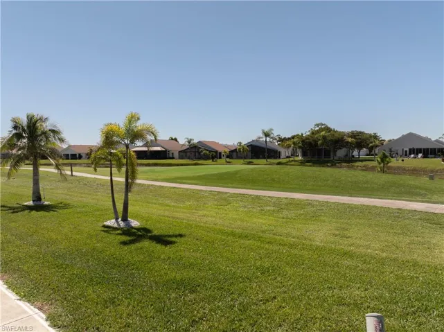 View of community featuring a lawn