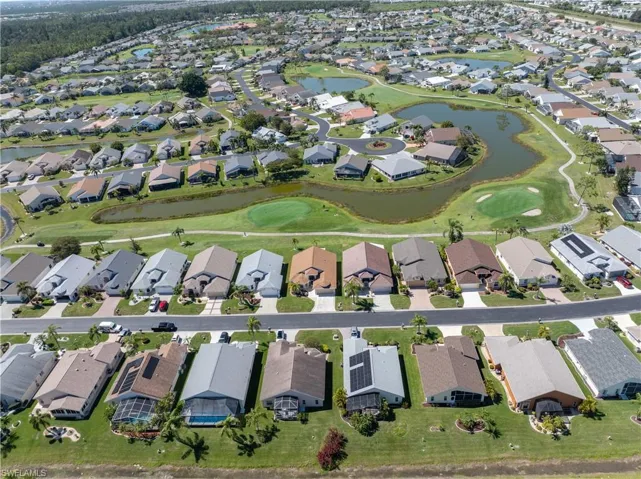 Aerial view with a residential view, a water view, and golf course view