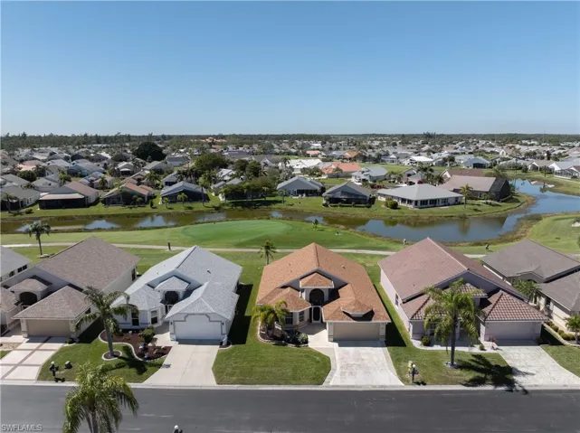 Bird's eye view with a water view and a residential view