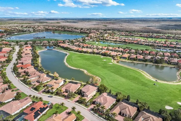 Aerial perspective showcasing a residential community with tile-roofed homes