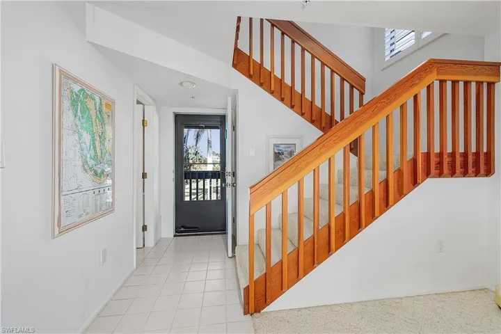 Foyer with plenty of natural light and light tile patterned flooring