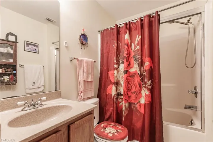 Full bathroom with toilet, shower / bathtub combination and vanity