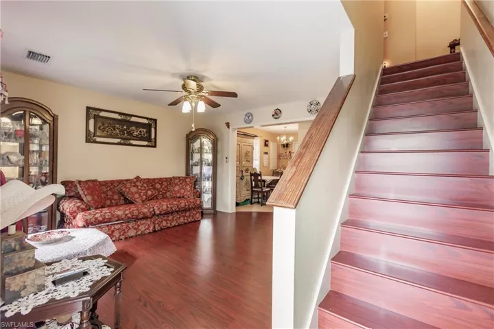 Entrance from Front Door into Great Room and staircase that leads upstairs to 2 bedrooms and 1 full bathroom