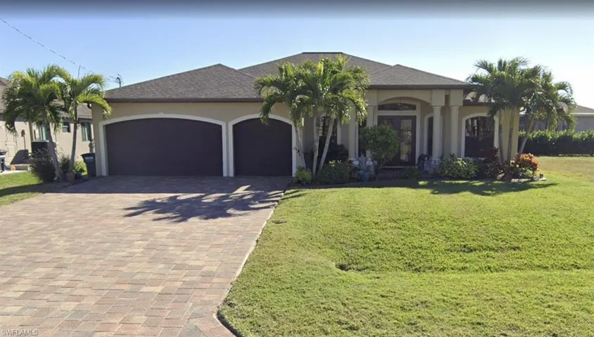 Ranch-style house with stucco siding, decorative driveway, roof with shingles, a front lawn, and an attached garage