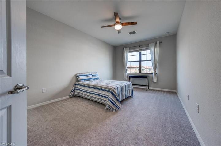 1st guest bedroom with walk-in closet