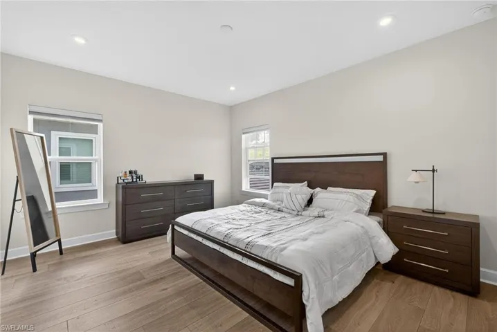Bedroom with light wood-style flooring and recessed lighting