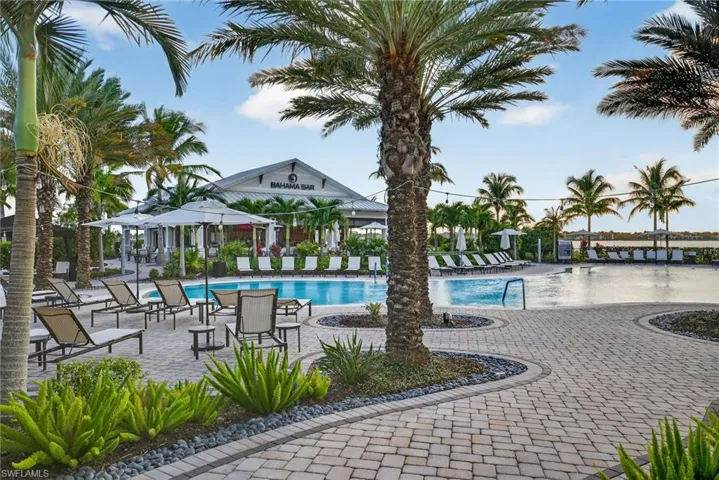 Community pool with a patio